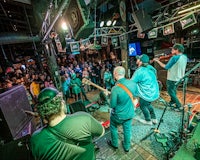 a band performs in front of a crowd of people